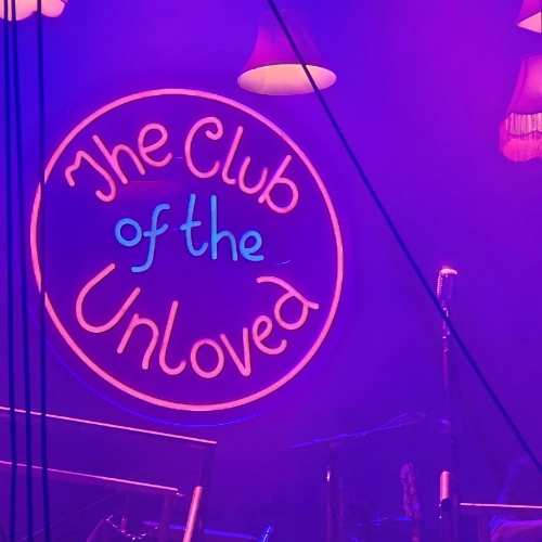 Neon sign saying The Club of the Unloved